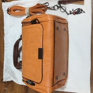 Closet rituals bag with cat keychain and strap